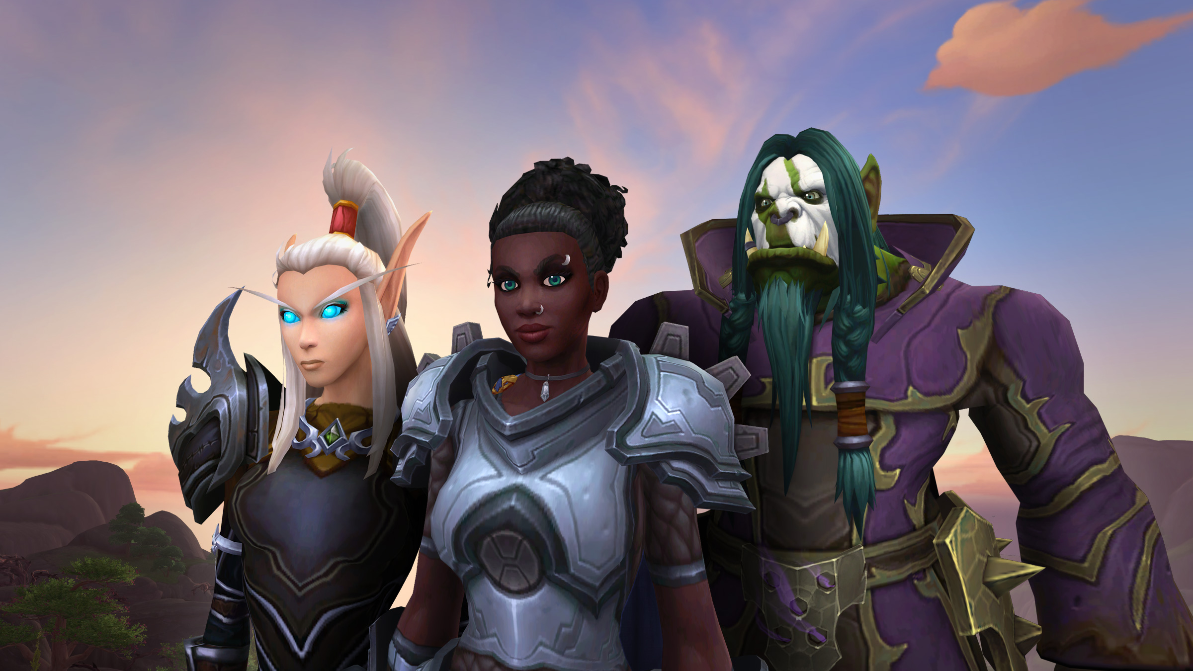 Three World of Warcraft characters standing together at sunset.